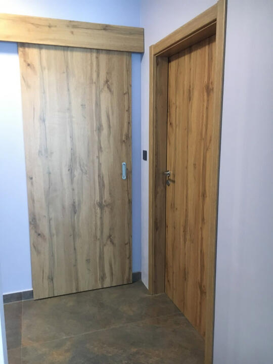 Coordinated made-to-measure sliding and hinged interior doors in matching finish