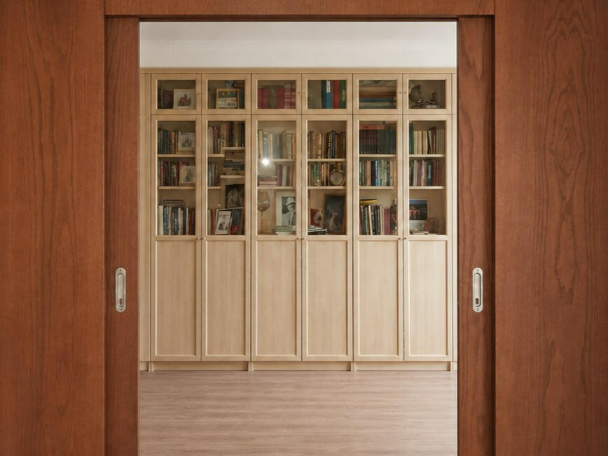 Custom extra-wide double sliding door system in the open position